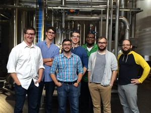 Electrical Construction Design & Management students smiling while on an electrical tour of Surly Brewing Company. 