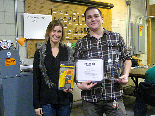 Molly Kujawa from Klein Tools honors Max Orman with the semi-annual Outstanding Graduate award.