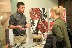 Second-year Design & Graphics Technology student talks to prospective employers at the annual Design & Graphics Intern Expo. 