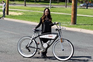 Stevie Nguyen with the bicycle she helped design and build with her group The Hacks as a capstone project for their degree.