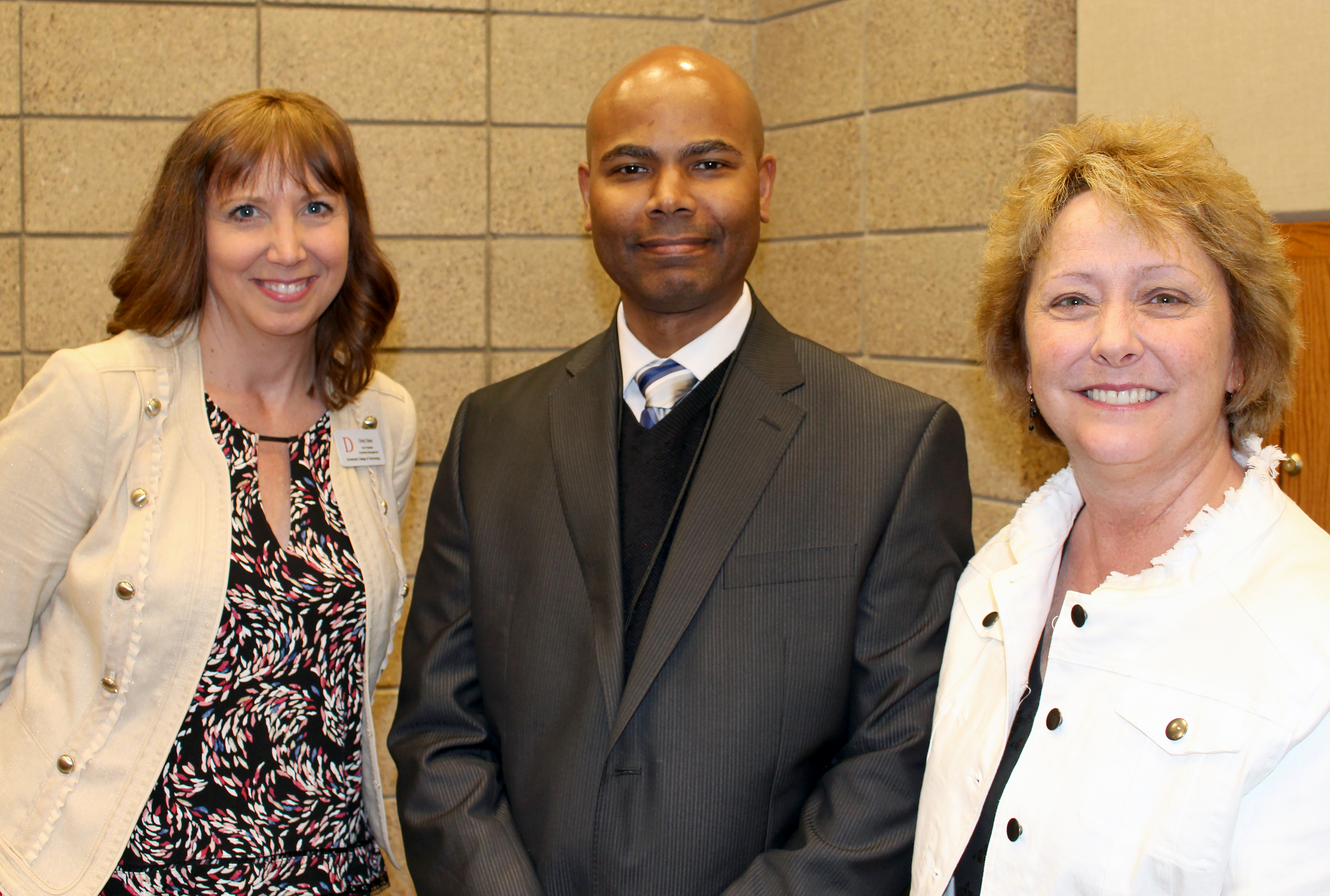 From left to right: Vice President of Enrollment Management Cindy Olson, Principal of Ascension Catholic School Benito Matias, and Associate Director of Special Initiatives Peggy Quam