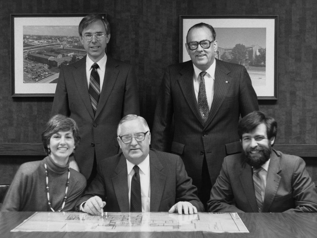 A photo of Warren Phillips and his team during his tenure as president