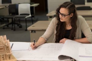 Dunwoody Construction Management student verifying blueprints
