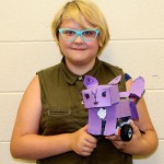 Photo of student with robot