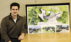 Student Austin Rastall with his one of his final boards for the Como Park project.