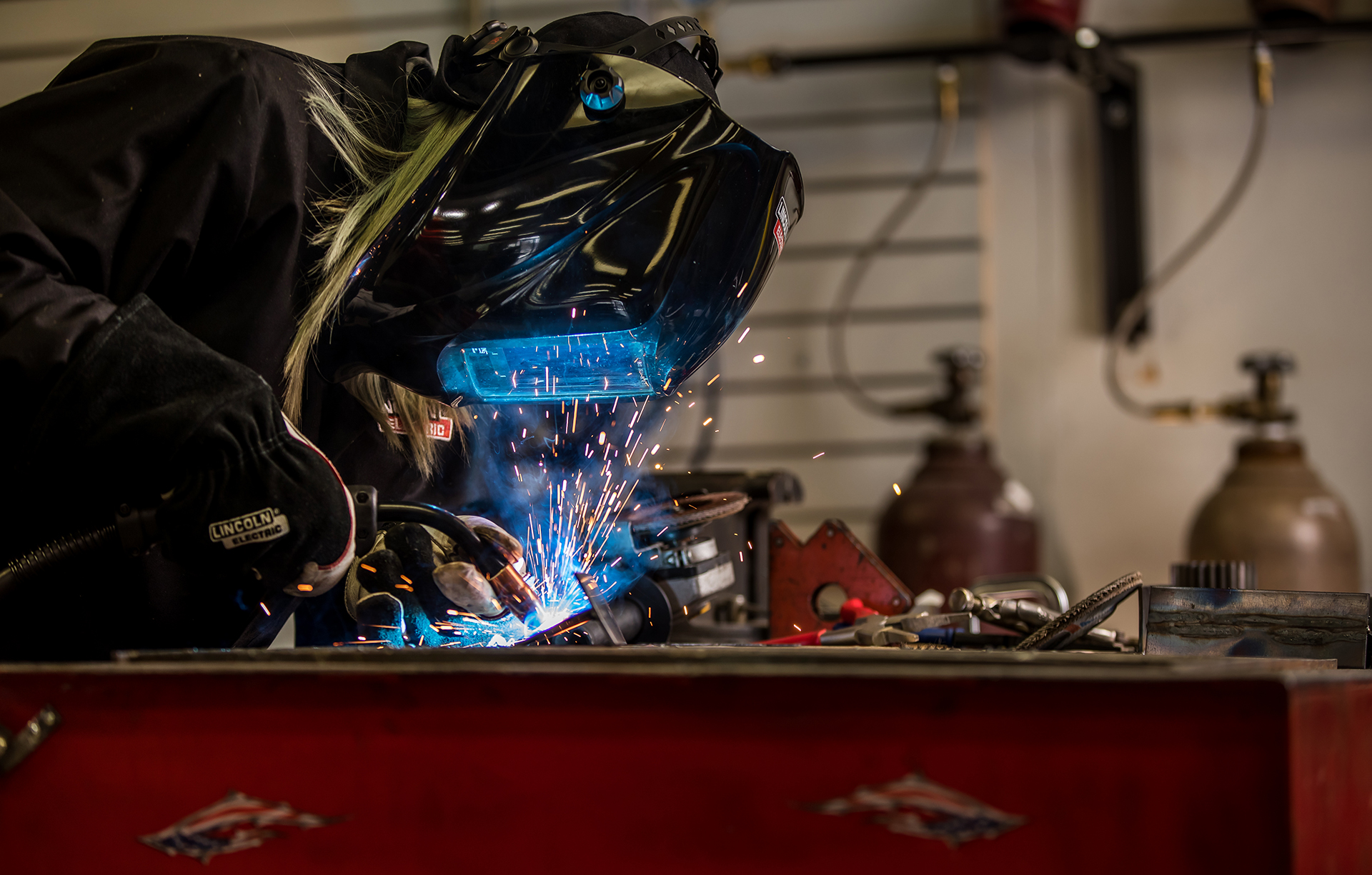 Alex Mars welds in her Lakeville shop.