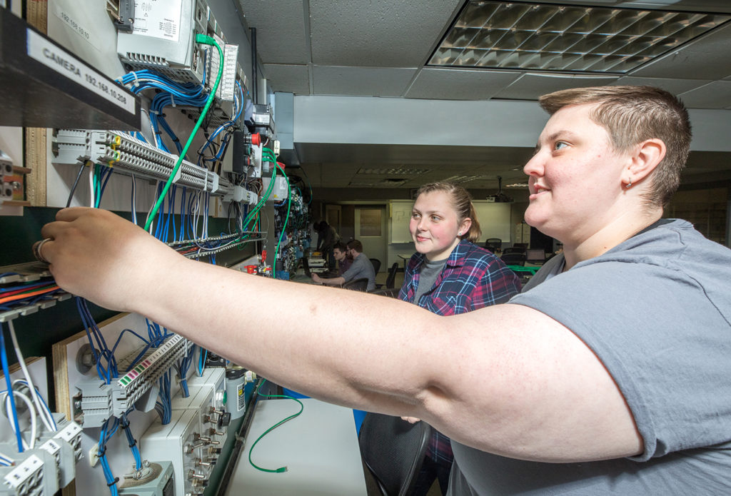 Ace High, right, works on a project in their Industrial Automation Lab.