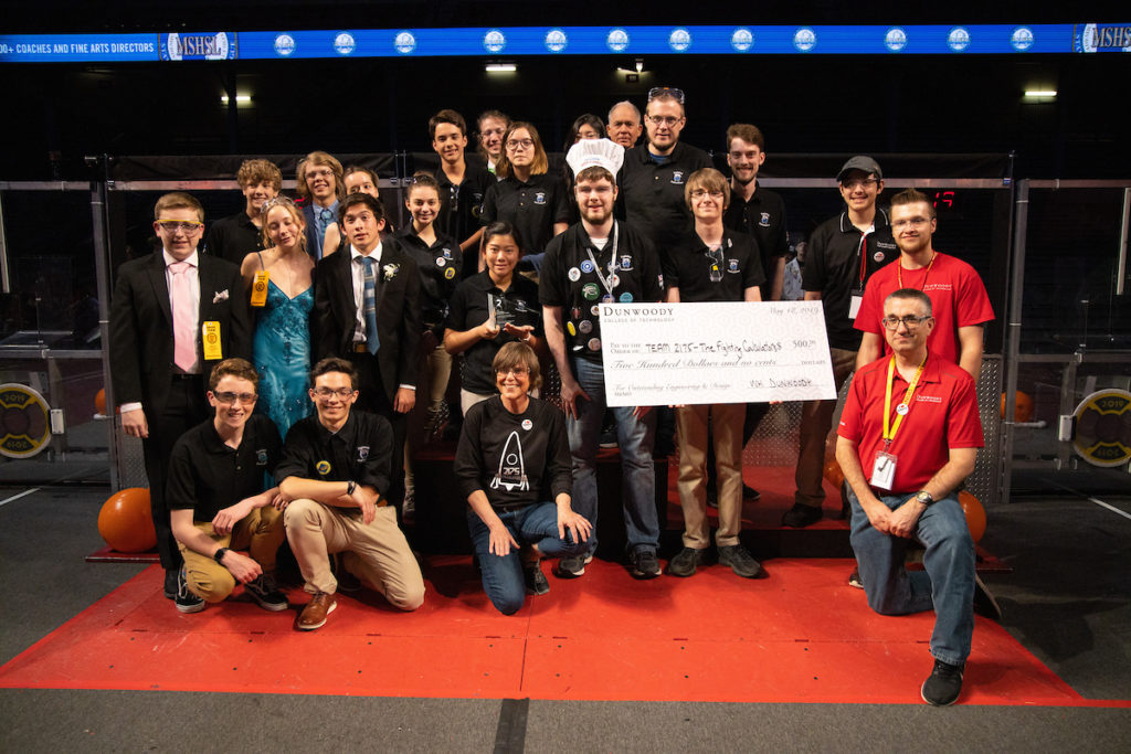 Photo of the Woodbury Fighting Calculators team with a giant check