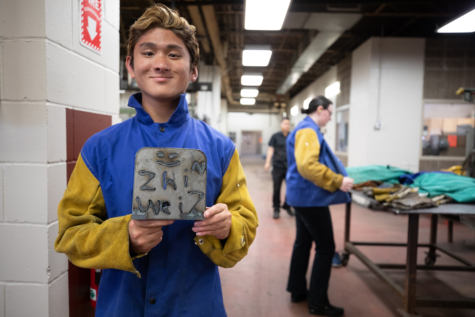 Zhiwei Blaubach shows off his welding creation that he made during a YCAP session.