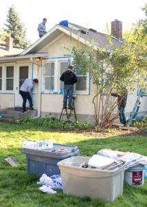 Industrial Engineering students paint the house of a homeowner in need.