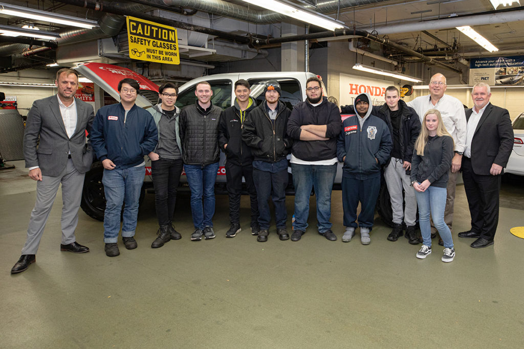 students in front of diesel truck