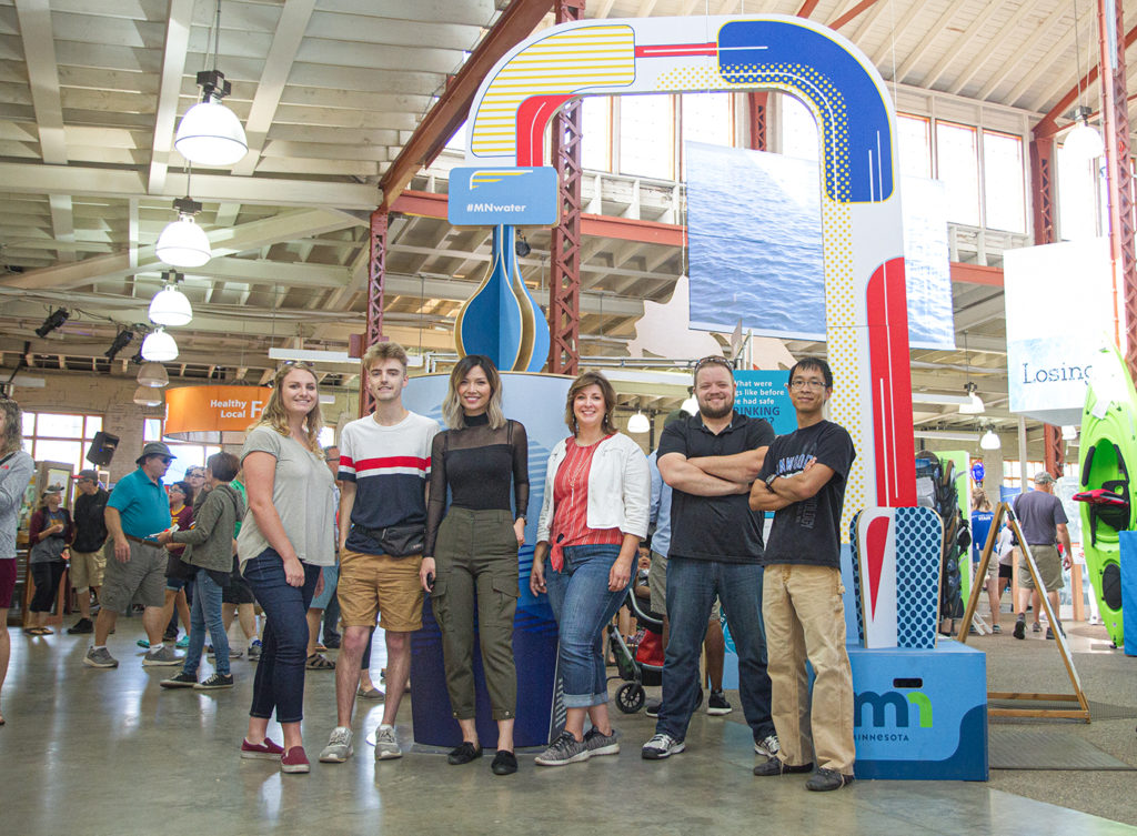 Michele Stenzel, fourth from left, with group she collaborated with to create the water project design on display at the Minnesota State Fair.