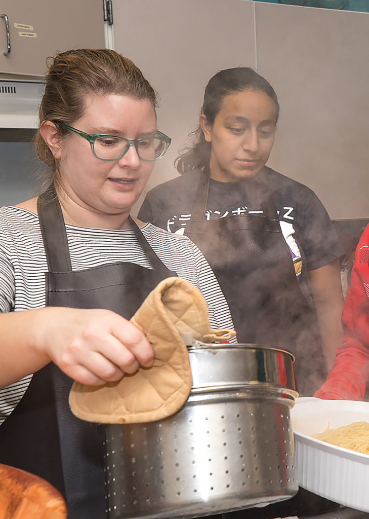 Liz Rivas, right, along with Maggie Whitman, left, associate director of Women's Initiatives, volunteer their time at the Jeremiah Program. 