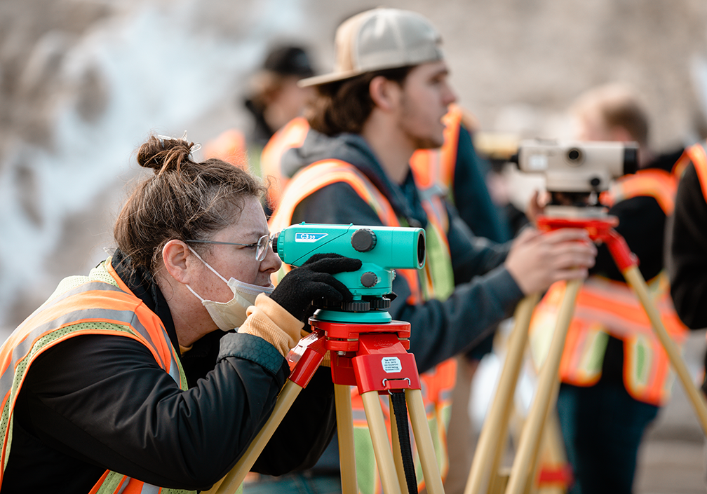 Dunwoody students train on equipment used in land surveying careers. 