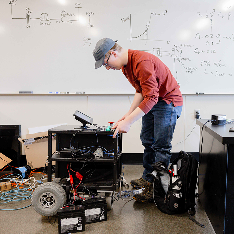 person controlling a robot