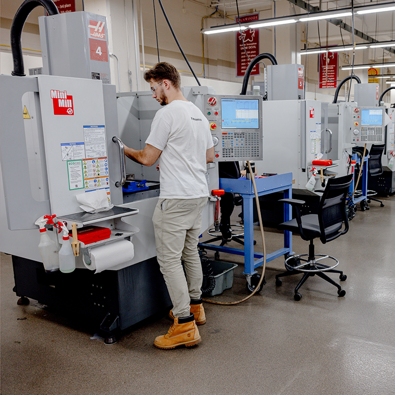 Student at CNC machine