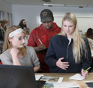 Dunwoody design students discussing a project