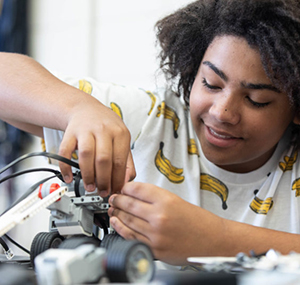 Photo of a student building a robot