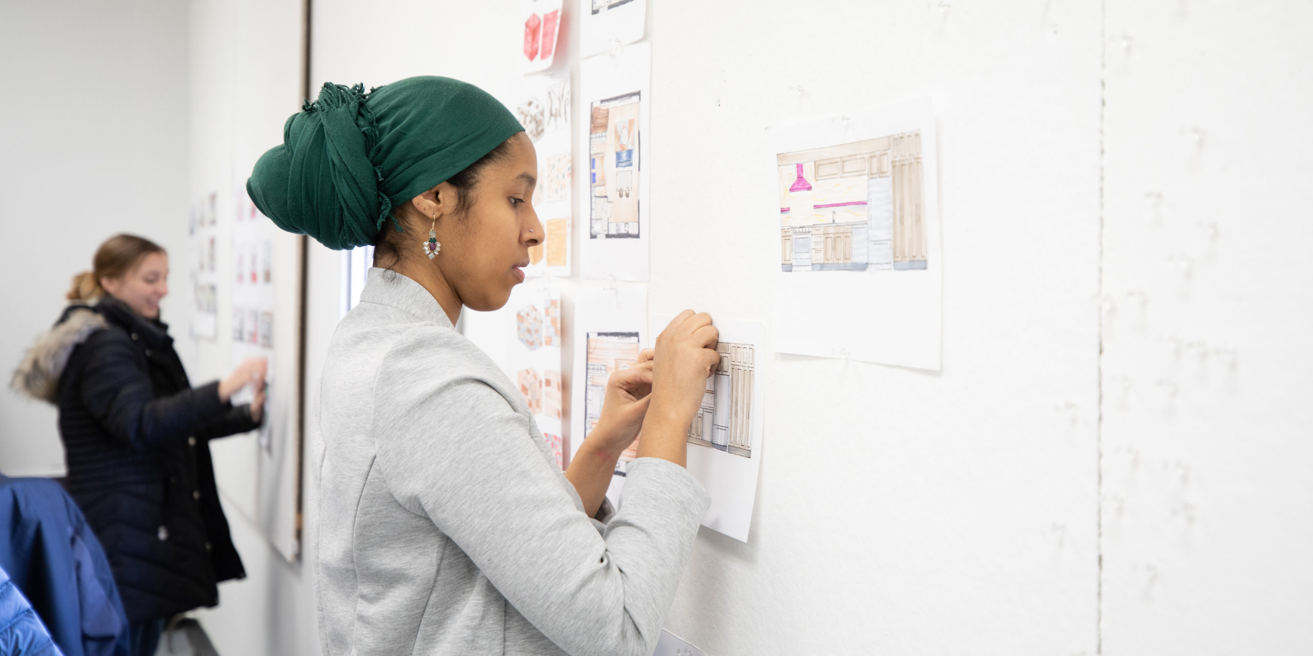 Student Sumeya Mohamed works on an Interior Design board