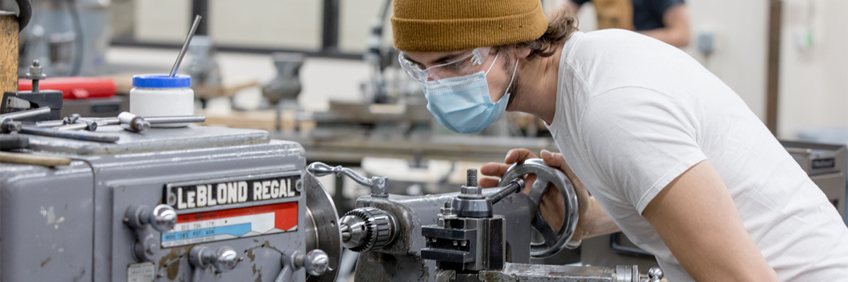 A student working in the machine shop