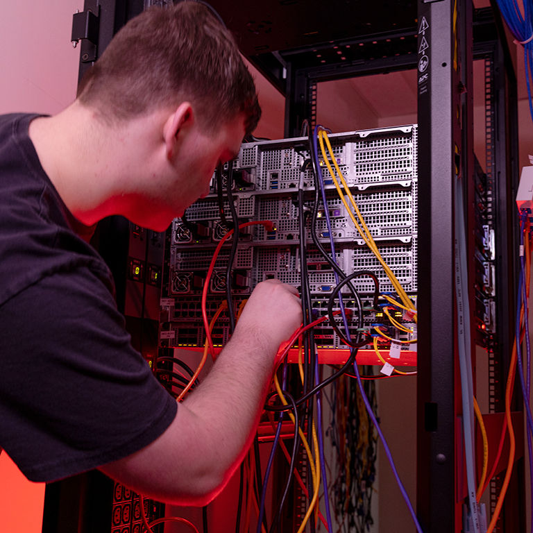 photo showing cloud engineering student working on a server