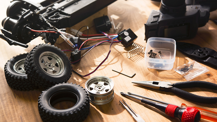 A set for building a model car, including wiring for the motor