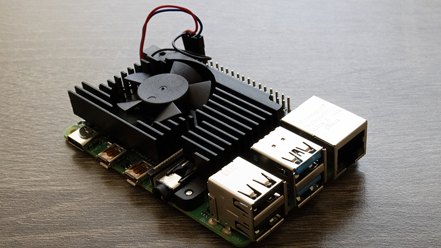A raspberry pi with processor, fan, and connectors